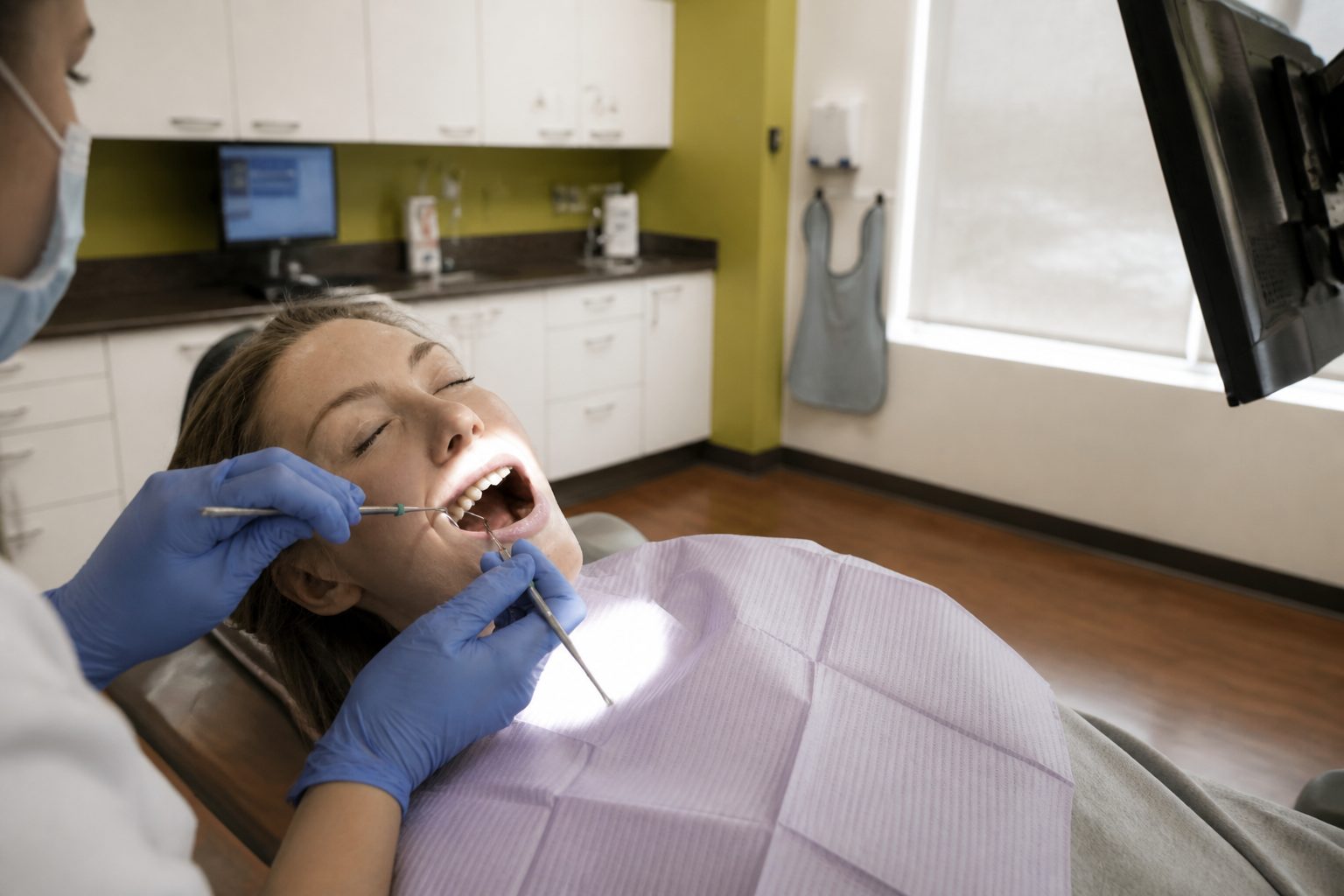 Dental exam assessing gum and tooth health